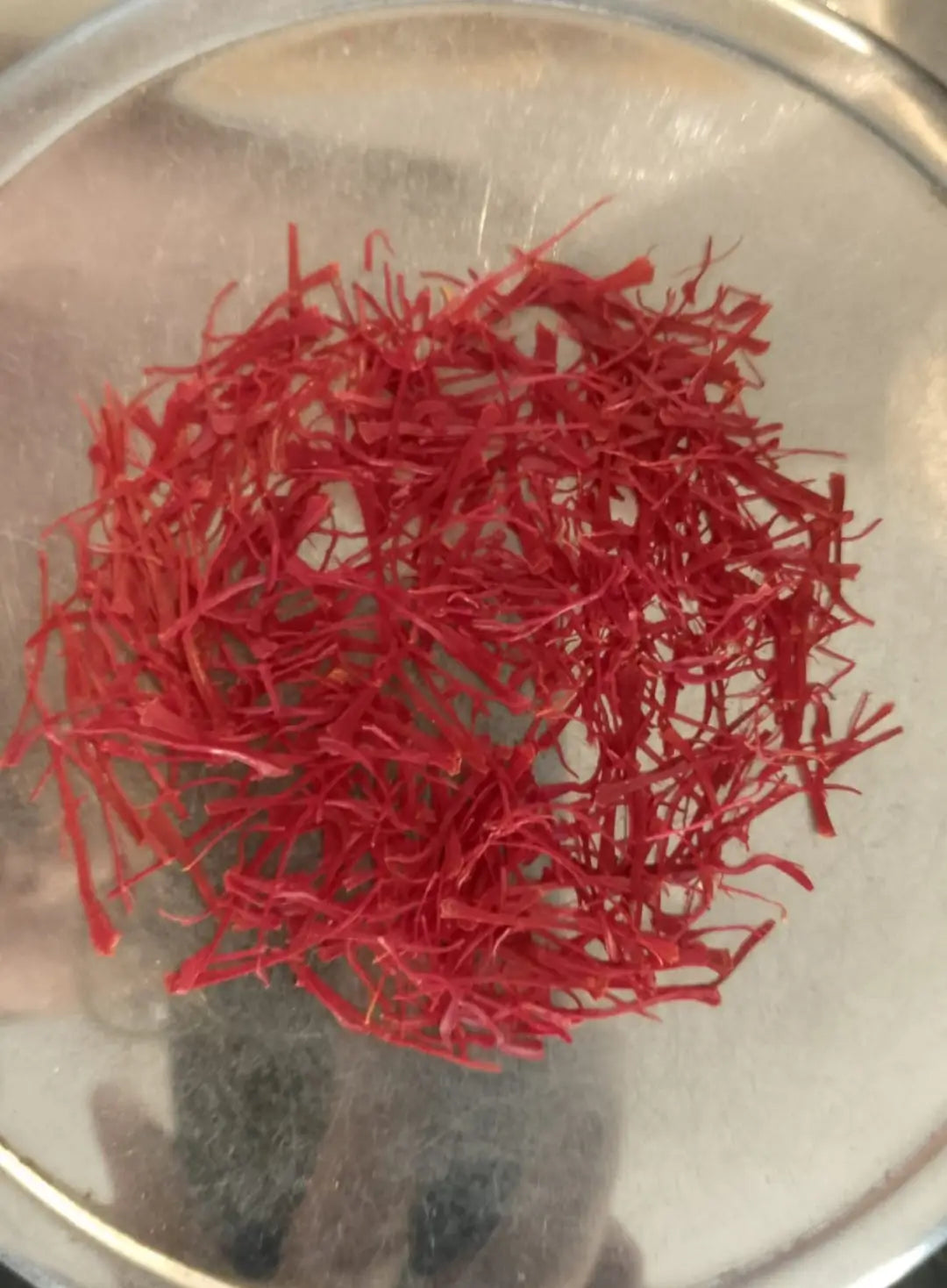 Premium saffron threads from Spain, showcasing their rich red color and unique texture for culinary use.